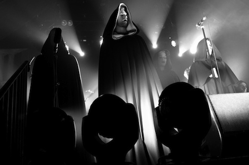 A photograph of the hooded cult.